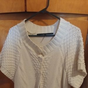 Cream colored shirt.